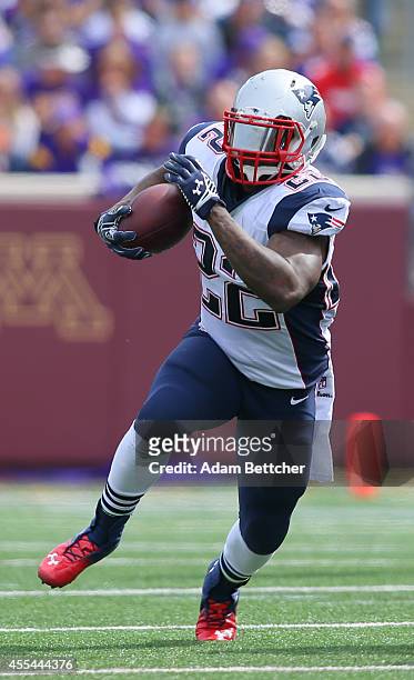 Stevan Ridley of the New England Patriots carries the ball for a gain in the second quarter against the Minnesota Vikings at TCF Bank Stadium on...