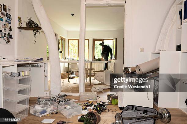 germany, north rhine westphalia, mature man running through window - einbruch stock-fotos und bilder