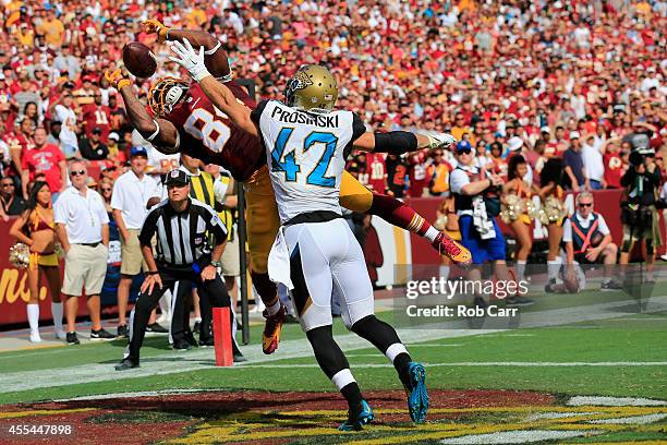 Tight end Niles Paul of the Washington Redskins catches a fourth quarter touchdown over strong safety Chris Prosinski of the Jacksonville Jaguars...