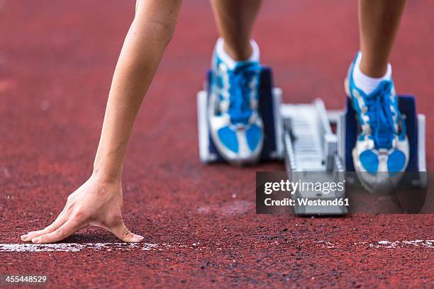 germany, young woman running from sprint start - sprint track stock pictures, royalty-free photos & images