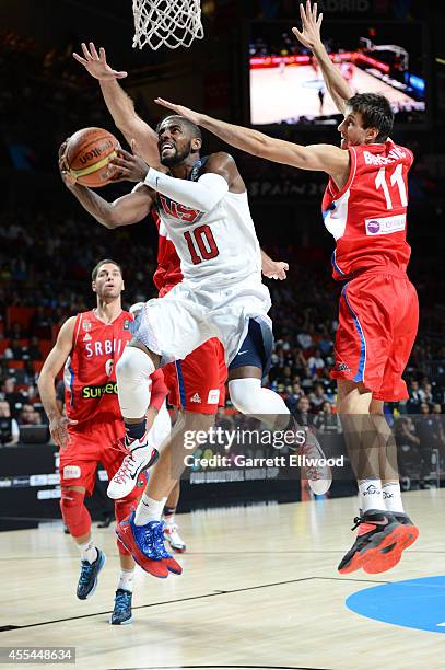 Kyrie Irving of the USA Men's National Team shoots against the Serbia National Team during the 2014 FIBA World Cup Finals at Palacio de Deportes on...