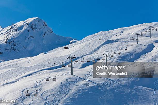 switzerland,carmenna, view of ski chair lift - wintersportort stock-fotos und bilder