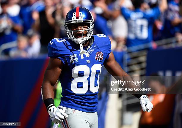 Wide receiver Victor Cruz of the New York Giants reacts to a pass interference call against cornerback Patrick Peterson of the Arizona Cardinals...