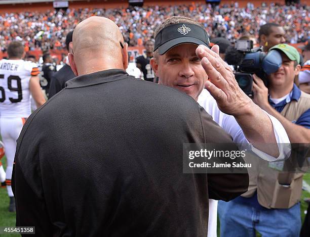 Head coach Sean Payton of the New Orleans Saints congratulates Mike Pettine of the Cleveland Browns after Clevelands 26-24 win at FirstEnergy Stadium...