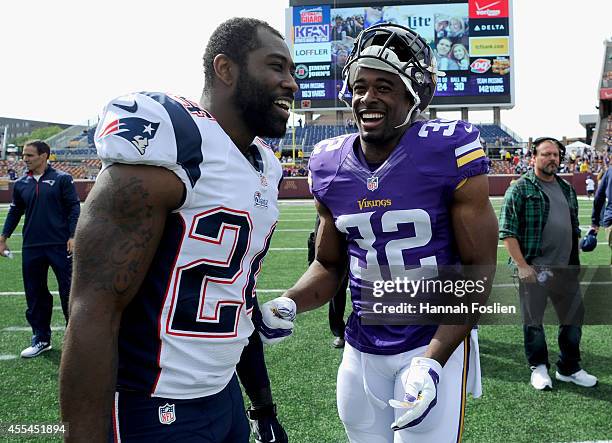 Darrelle Revis and Devin McCourty of the New England Patriots speak after the game on September 14, 2014 at TCF Bank Stadium in Minneapolis,...