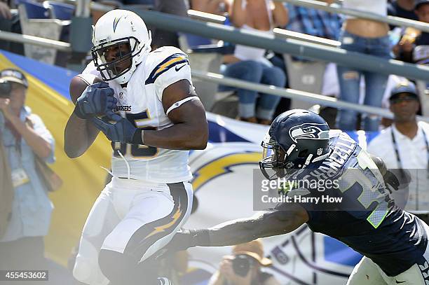 Tight end Antonio Gates of the San Diego Chargers catches a pass for a touchdown while defended by strong safety Kam Chancellor of the Seattle...