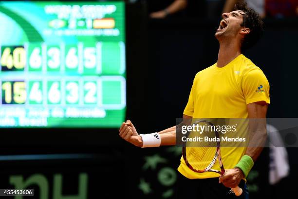 Thomaz Bellucci of Brazil reacts after winning his play-off singles match against Roberto Bautista Agut of Spain on the World Group Play-off round of...