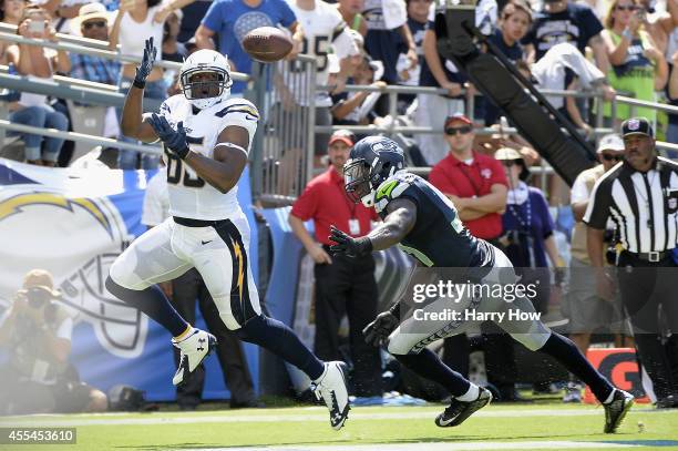 Tight end Antonio Gates of the San Diego Chargers catches a pass for a touchdown while defended by strong safety Kam Chancellor of the Seattle...