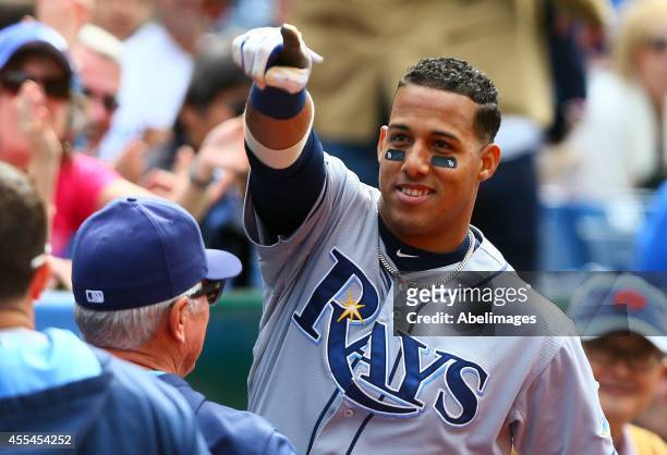 Yunel Escobar of the Tampa Bay Rays points to the fan that was heckling him after he hit a home run in the 8th inning against the Toronto Blue Jays...