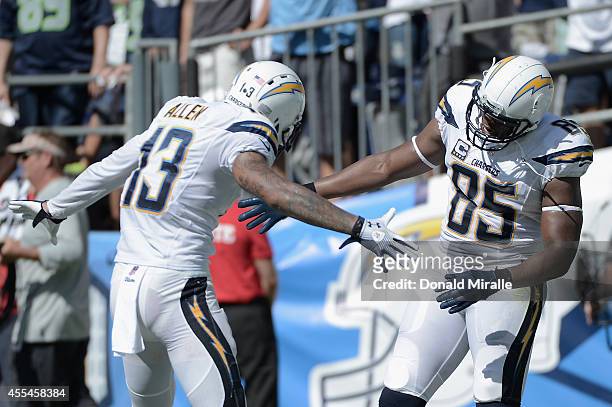 Tight end Antonio Gates of the San Diego Chargers is congratulated by teammate tight end John Phillips after scoring a touchdown against the Seattle...