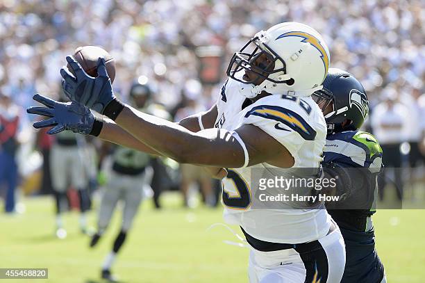 Tight end Antonio Gates of the San Diego Chargers catches a touchdown pass while defended by outside linebacker K.J. Wright of the Seattle Seahawks...