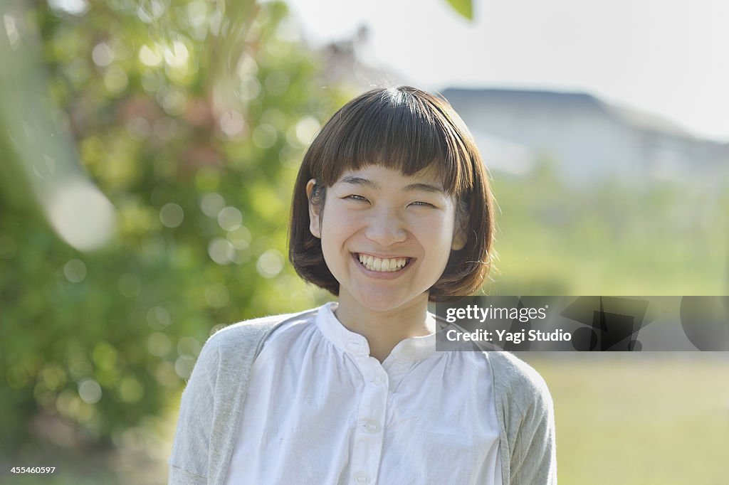 Smiling Woman in the green