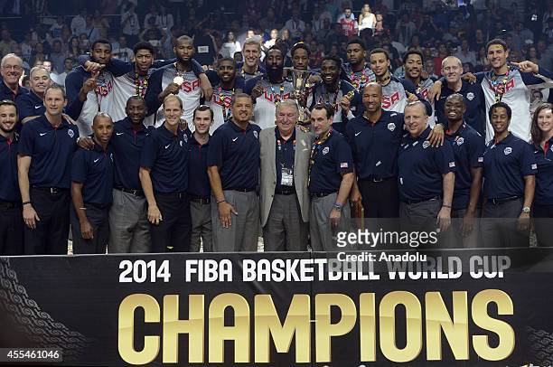 Players of USA and staff celebrate their victory with the trophy after winning the 2014 FIBA World Cup Final basketball match between USA and Serbia...
