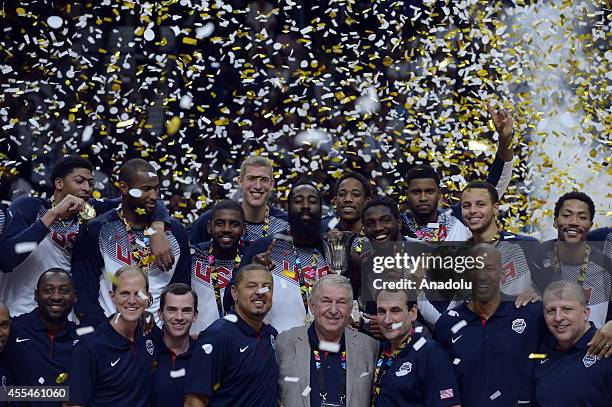 Players of USA and staff celebrate their victory with the trophy after winning the 2014 FIBA World Cup Final basketball match between USA and Serbia...