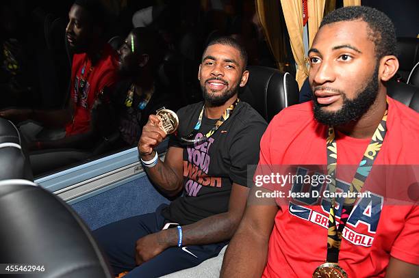 Kyrie Irving of the USA Men's National Team poses for a photo with the gold medal on the bus after defeating the Serbia National Team during the 2014...