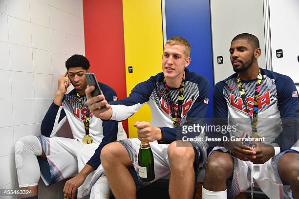 Mason Plumlee and Kyrie Irving of the USA Men's National Team poses for a photo with the gold medal in the locker room after defeating the Serbia...