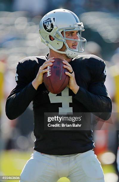 Quarterback Derek Carr of the Oakland Raiders throws against the Houston Texans in the fourth quarter on September 14, 2014 at O.co Coliseum in...