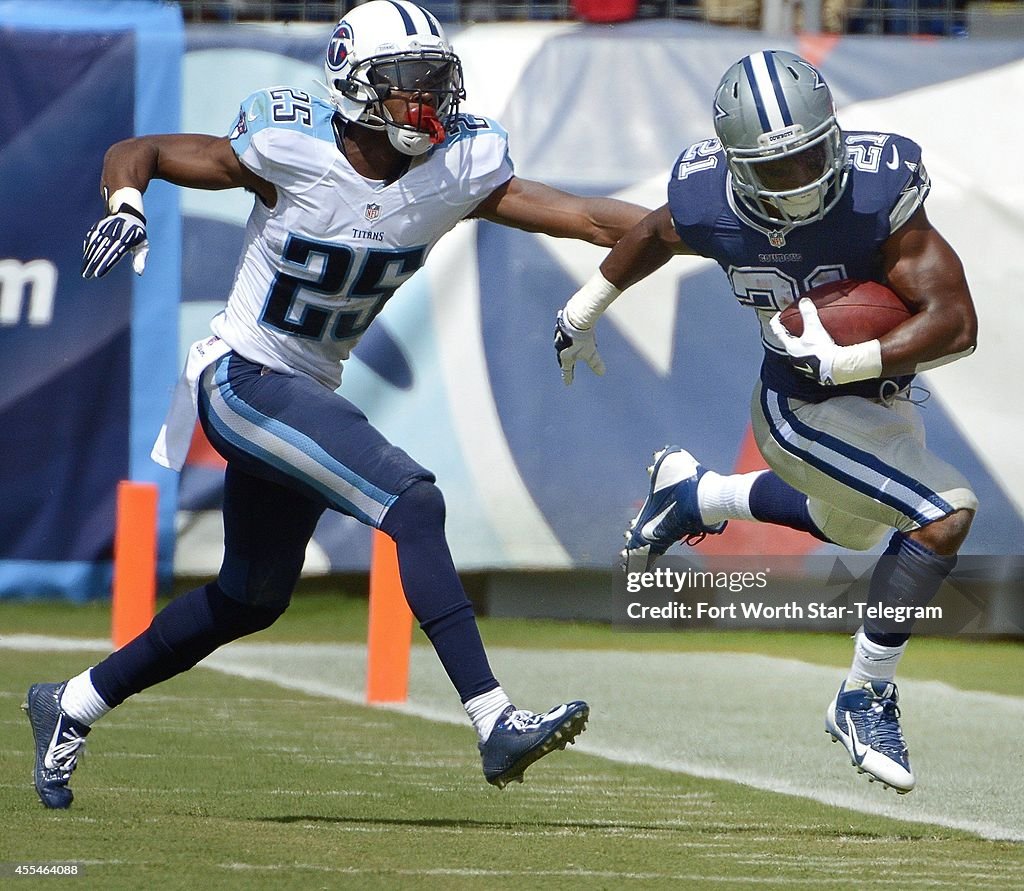 Cowboys crush Titans 26-10