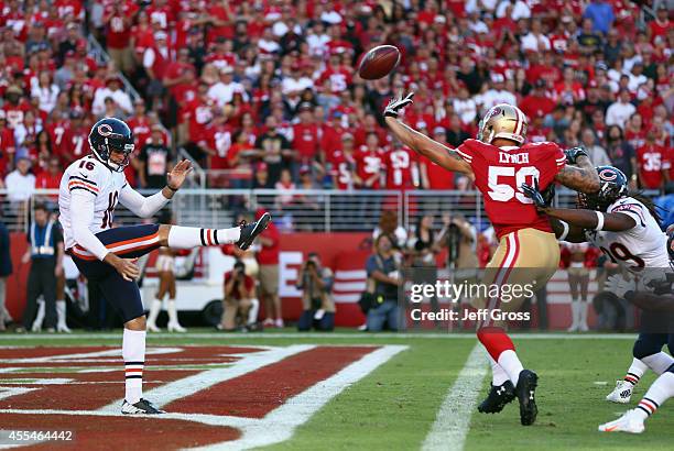 Linebacker Aaron Lynch of the San Francisco 49ers blocks punter Pat O'Donnell of the Chicago Bears during the first quarter of the game at Levi's...