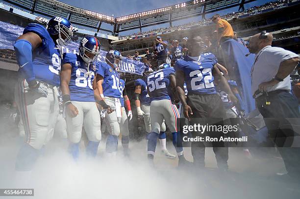 The New York Giants prepare to take the field against the Arizona Cardinals during a game at MetLife Stadium on September 14, 2014 in East...