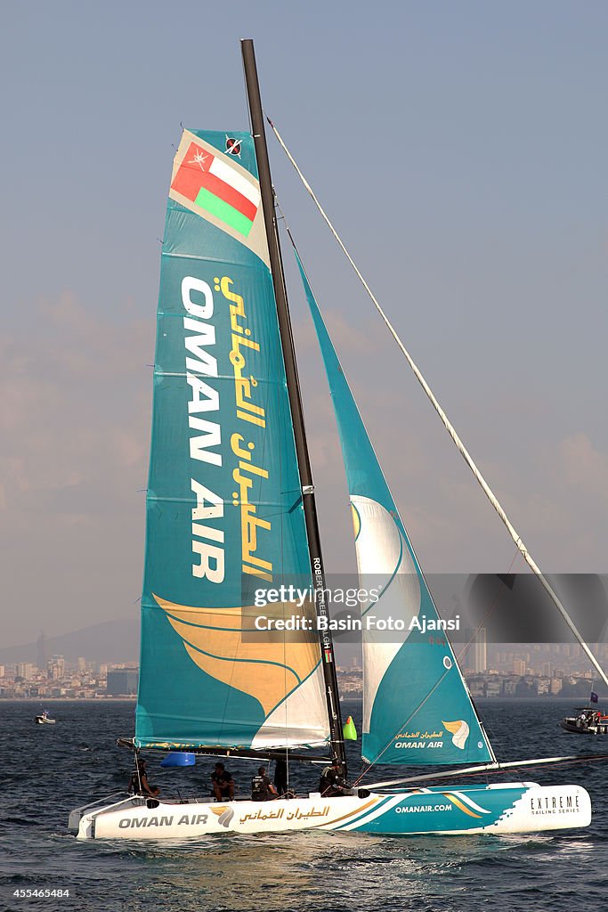 Boats race in the 2014 Extreme Sailing Series...