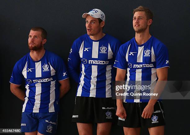 Leigh Adams, Nathan Grima and Kieran Harper of the Kangaroos watch on during a North Melbourne Kangaroos AFL training session at Arden Street Ground...