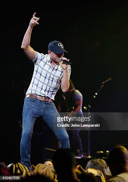 Cole Swindell performs at Barclays Center on September 14, 2014 in the Brooklyn borough of New York City.