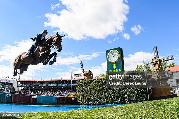 Kent Farrington of the United States riding Voyeur competes in the individual jumping equestrian on the final day of the Masters tournament at Spruce...