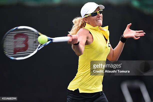 Anastasia Rodionova of Australia returns a shot during her women's singles match against Daria Gavrilova of Russia during day one of the Toray Pan...