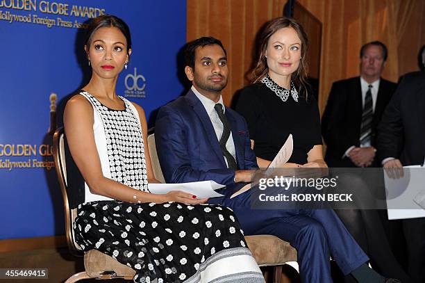 Actors, from left, Zoe Saldana, Aziz Ansari and Olivia Wilde attend the 71th Annual Golden Globes Awards nominations event, December 12, 2013 at the...