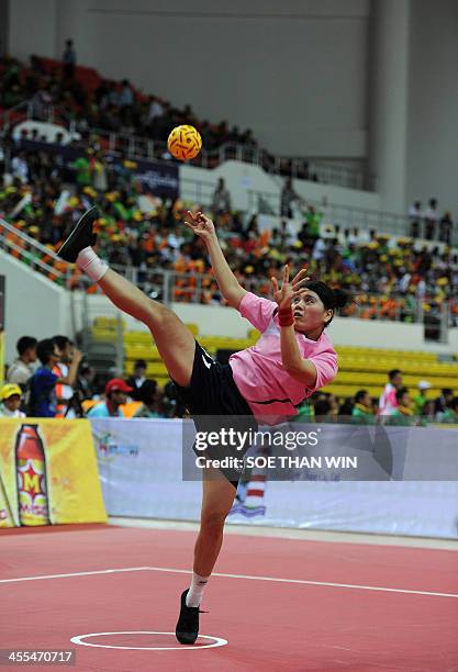 Rike Media Sari from Indonesia plays during the Sepaktakraw women's event during the 27th Southeast Asian Games in Naypyidaw on December 12, 2013....