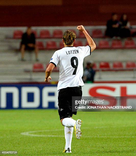Germany's midfielder Lena Lotzen celebrates after scoring during the UEFA Women's European Championship Euro 2013 group B football match Iceland vs...