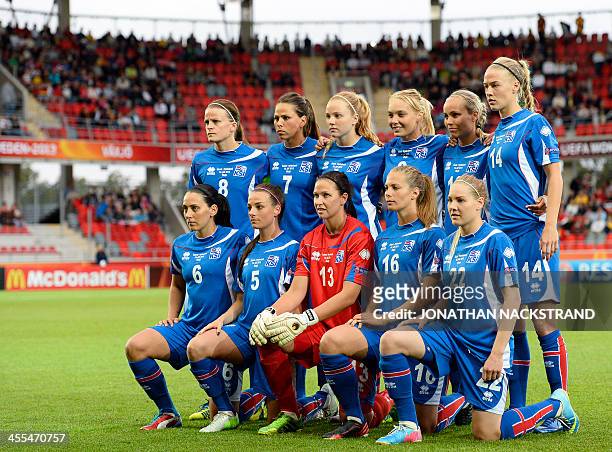 Iceland's players pose for their team's photo prior to the UEFA Women's European Championship Euro 2013 group B football match Iceland vs Germany on...