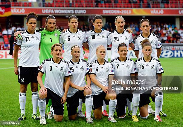 Germany's players pose for their team's photo prior to the UEFA Women's European Championship Euro 2013 group B football match Iceland vs Germany on...
