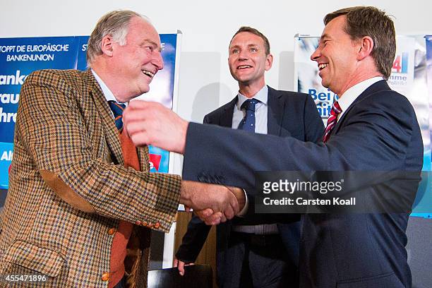 Bernd Lucke , head of the Alternative fuer Deutschland political party, smiles as he attends a press conference with colleague AfD Brandenburg lead...
