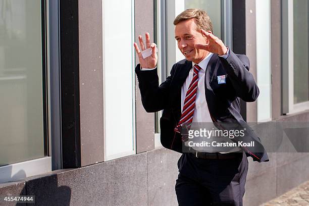 Bernd Lucke, head of the Alternative fuer Deutschland political party, smiles as he left a pressconference the day after the AfD finished with strong...