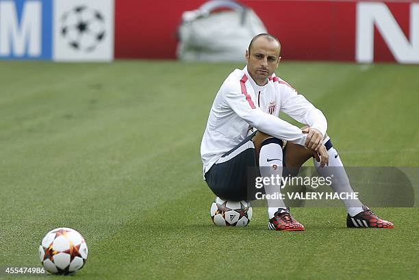 Monaco's Bulgarian forward Dimitar Berbatov takes part in a training session on the eve of the Champions League football match opposing Monaco to...