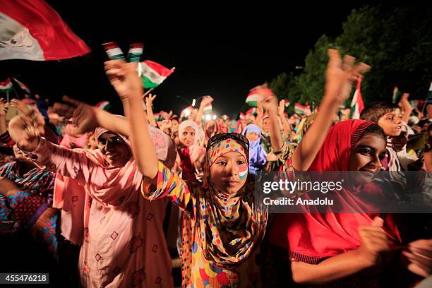 Anti-government protestors chant slogans during the ongoing anti-government protest in Islamabad's Red Zone where the state buildings and parliament...