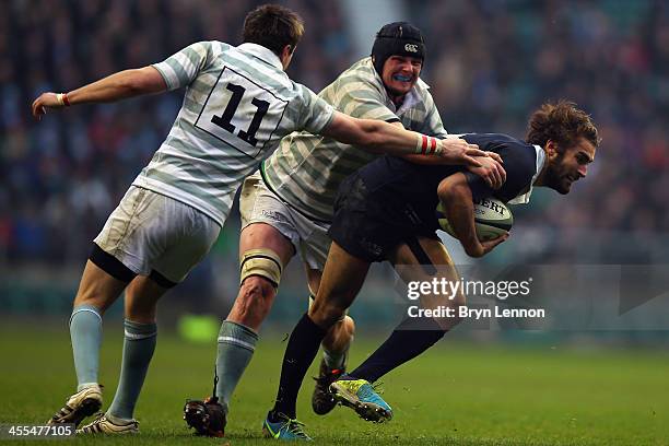 Matt Janney of Oxford University is tackled by Andy Murdoch and Scott Annett of Cambridge Universityduring the Varsity Match between Oxford...