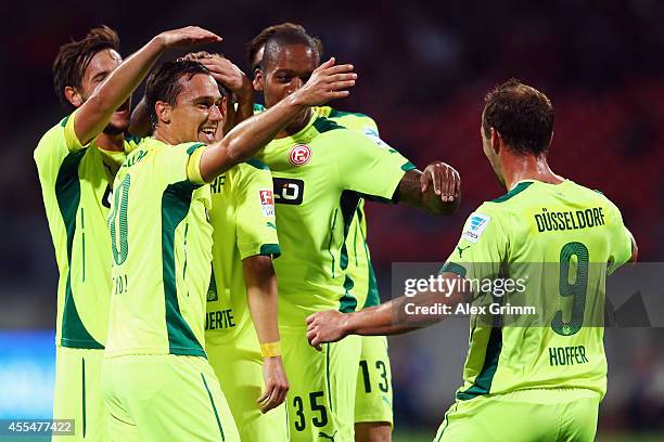 Erwin Hoffer of Duesseldorf celebrates his team's first goal with team mates during the Second Bundesliga match between 1. FC Nuernberg and Fortuna...