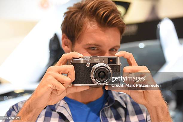 The new Fuji X100T camera with the Fujinon Super EBC f 23 mm lens is presented at the Photokina 2014 trade fair on September 15, 2014 in Cologne,...