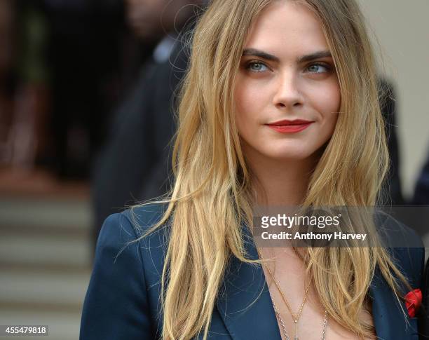 Cara Delevingne attends the Burberry Prorsum show during London Fashion Week Spring Summer 2015 on September 15, 2014 in London, England.