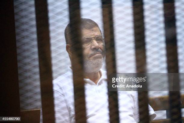 Mohamed Morsi is seen during a trial over the Wadi el-Natrun prison case at Cairo Police Academy in Egypt, on September 15, 2014. Cairo Criminal...