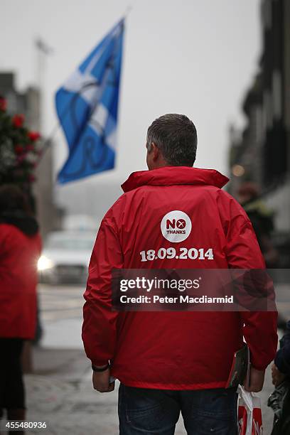 No campaigner stands near a yes campaign Saltire flag on September 15, 2014 in Aberdeen,Scotland. The latest polls in Scotland's independence...