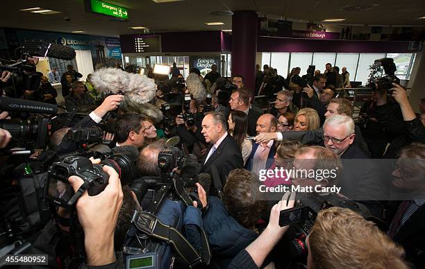 First Minister Alex Salmond speaks with the media at Edinburgh International Airport following a photocall in the arrival's hall on September 15,...