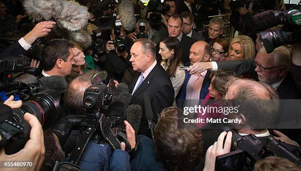 First Minister Alex Salmond speaks with the media at Edinburgh International Airport following a photocall in the arrival's hall on September 15,...