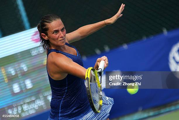 Roberta Vinci of Italy returns a shot during her match against Lin Zhu of China during day one of the 2014 WTA Guangzhou Open at Taint Sports Center...