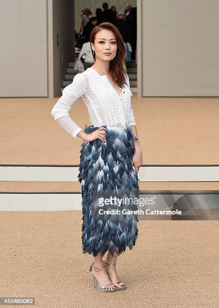Joey Yung attends the Burberry Womenswear SS15 show during London Fashion Week at Kensington Gardens on September 15, 2014 in London, England.