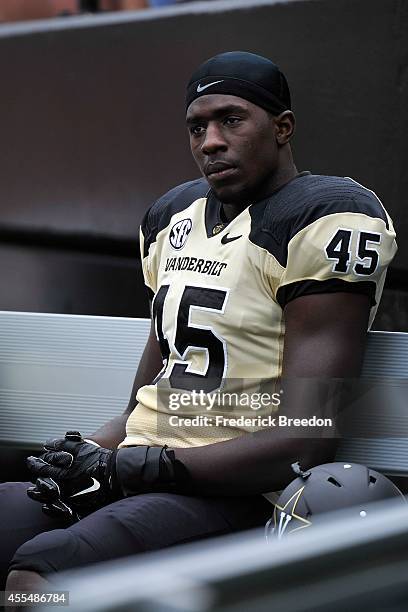 Stephen Weatherly of the Vanderbilt Commodores watches from the sideline during a game against the University of Massachusetts Minutemen at...