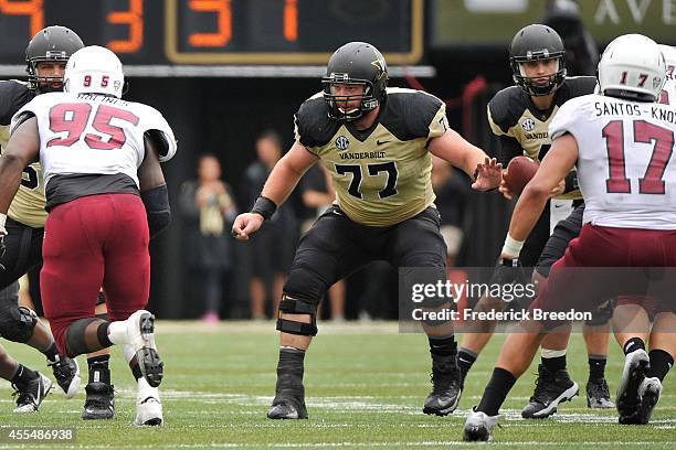 Spencer Pulley of the Vanderbilt Commodores plays against the University of Massachusetts Minutemen at Vanderbilt Stadium on September 13, 2014 in...